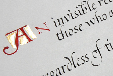 Quote in italic with Lombardic style capitals and gold leaf